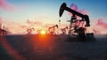 Pump jack industrial machinery for petroleum in the sunrise. Silhouettes of a pump jack pumping oil against a red sky Royalty Free Stock Photo