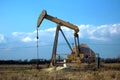 Pump jack pumping oil from the earth