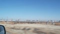 Pump jacks on oil field, USA. Rigs for crude fossil extraction on oilfield wells Royalty Free Stock Photo