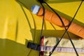 Pump and paddle float on deck of yellow sea kayak