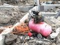 pump pressure for pest control install in new building house site. orange rubber tube prepare for construction
