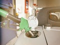 Pump refilling car with fuel at gas station Royalty Free Stock Photo