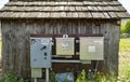 Pump switch and electrical boxes on an old wood building in central Oregon, USA - June 7, 2022 Royalty Free Stock Photo