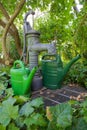 Pump well and watering cans 01 Royalty Free Stock Photo