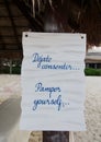 Pamper Yourself sign at white sand beach Royalty Free Stock Photo
