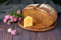 Pumpernickel - bread made with a combination of rye flour and whole rye grains. Cheese, clover flowers. Fresh healthy farm food