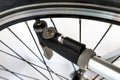 Pumping the bicycle wheel using a hand pump with air pressure indicator in units of bar / psi. Royalty Free Stock Photo