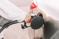 Pumping gas fuel car at oil station. Woman hand refuel petrol nozzle tank. Refueling transportation and Automotive industry Royalty Free Stock Photo