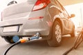 Pumping gas fuel car at oil station. Woman hand refuel petrol nozzle tank. Refueling transportation and Automotive Royalty Free Stock Photo