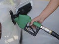 Closeup of man pumping gasoline fuel in car at gas station Royalty Free Stock Photo