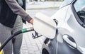 Pumping gas and diesel at pump. Close-up of a fuel pistol for refueling gasoline and diesel. Royalty Free Stock Photo