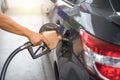 Pumping gasoline fuel in car at gas station pump, refueling Fossil Fuel. Royalty Free Stock Photo