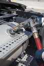 Fueling a truck wearing safety gloves Royalty Free Stock Photo