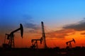 pumping unit and the silhouette of oilfield derrick