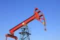 pumping unit walking beam under blue sky Royalty Free Stock Photo