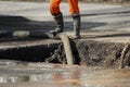 Pumping water out of the pit when eliminating an accident: rupturing pipes with cold water. Royalty Free Stock Photo