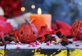 Pumpkin on a background of dry plants and candles Royalty Free Stock Photo