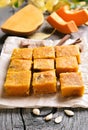 Pumpkin bars on wooden table Royalty Free Stock Photo