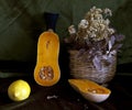 Pumpkin, baskets and dry flowers. Still life