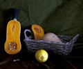 Pumpkin, baskets and lemon. Still life