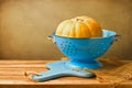 Pumpkin in blue colander