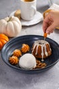 Pumpkin bundt cake soaked with rum served with ice cream Royalty Free Stock Photo