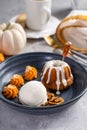 Pumpkin bundt cake soaked with rum served with ice cream Royalty Free Stock Photo