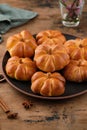 Pumpkin buns bread with spices on brown background. Halloween Food Concept. Autumn concept. Royalty Free Stock Photo