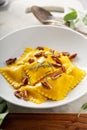 Butternut squash tortellini with brown butter and pecans Royalty Free Stock Photo