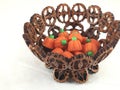 Pumpkin candies in nut shell bowl Royalty Free Stock Photo