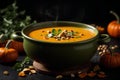 Pumpkin and carrot Cream soup on dark background. Commercial promotional food photo