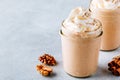 Pumpkin and carrot spice latte with whipped cream and cinnamon in glass jars Royalty Free Stock Photo