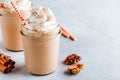 Pumpkin and carrot spice latte with whipped cream and cinnamon in glass jars Royalty Free Stock Photo
