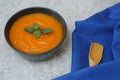 Pumpkin or carrot or sweet potato soup puree in a bowl on a black background with spoon. Copy space. Isolated. Food background Royalty Free Stock Photo