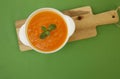 Pumpkin or carrot or sweet potato soup puree in a bowl on a green background. Copy space. Isolated. Diet. Food background Royalty Free Stock Photo