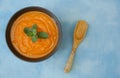 Pumpkin or carrot or sweet potato soup puree in a bowl on a blue background Copy space Isolated. Diet Food background Royalty Free Stock Photo