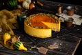 Pumpkin cheesecake with caramel sauce and seeds on top Royalty Free Stock Photo