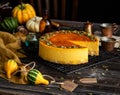 Pumpkin cheesecake with caramel sauce and seeds on top Royalty Free Stock Photo