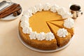 Pumpkin cheesecake with fall spices topped with whipped cream