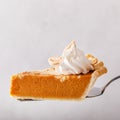 Pumpkin cheesecake swirl pie topped with whipped cream Royalty Free Stock Photo