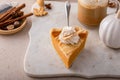 Pumpkin cheesecake swirl pie topped with whipped cream Royalty Free Stock Photo