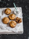 Pumpkin and cream cheese swirl muffins and greek yogurt. Delicious breakfast or snack. On a dark background, top view. Royalty Free Stock Photo