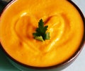 Pumpkin cream soup in bowl with parsley Royalty Free Stock Photo