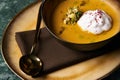 Pumpkin cream soup with cream and pumpkin seeds Royalty Free Stock Photo