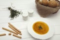 Pumpkin cream soup puree on a light wooden table in a white plate. top view Royalty Free Stock Photo