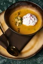 Pumpkin cream soup with cream and pumpkin seeds Royalty Free Stock Photo