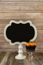 Pumpkin cupcake with blank chalkboard sign