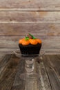 Pumpkin cupcake on wooden background