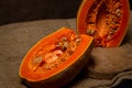 Pumpkin cut in half. Long pumpkin. Autumn vegetable.
