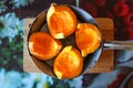 Pumpkin cut into quarters in a pan